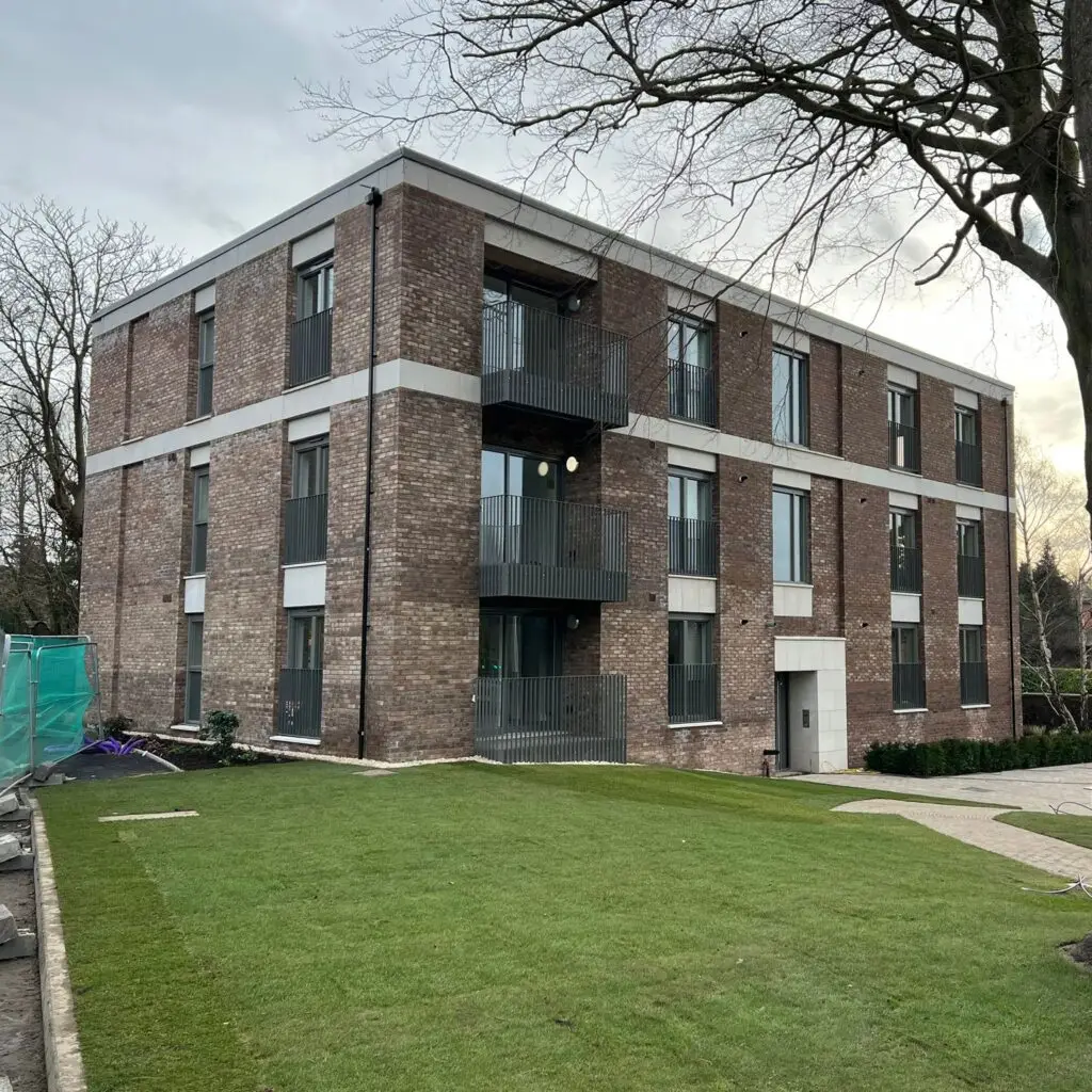 image of new build housing flats with lawn to front